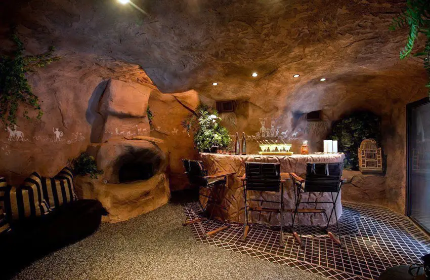 Custom cave with rock walls and drink bar