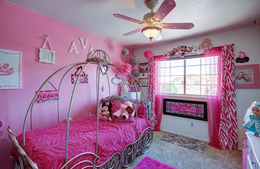 Disney princess girls bedroom in pink with canopy bed