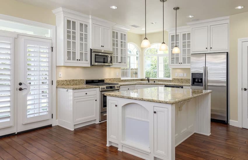 Kitchen with engineered oak hardwood flooring and yellow granite counters