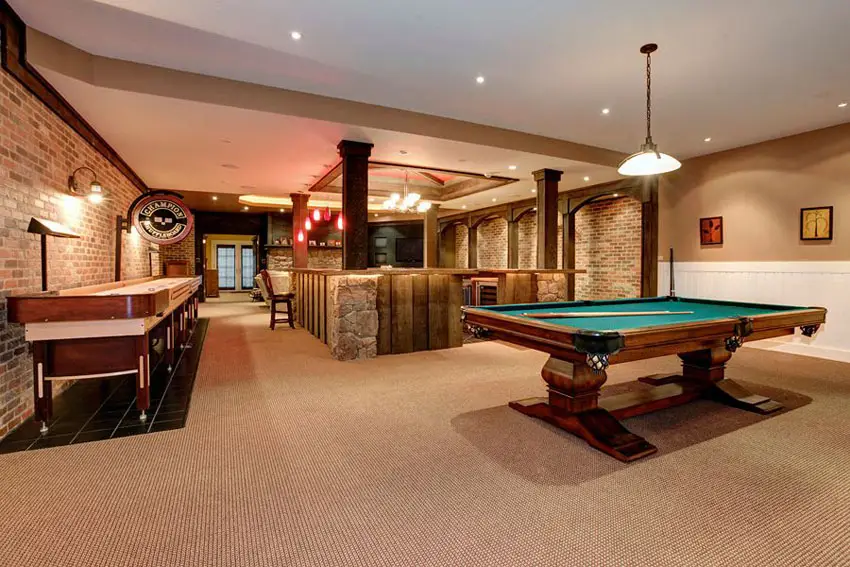 Basement billiards room with bar and shuffleboard