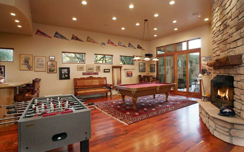 Game room with fireplace and hardwood floors