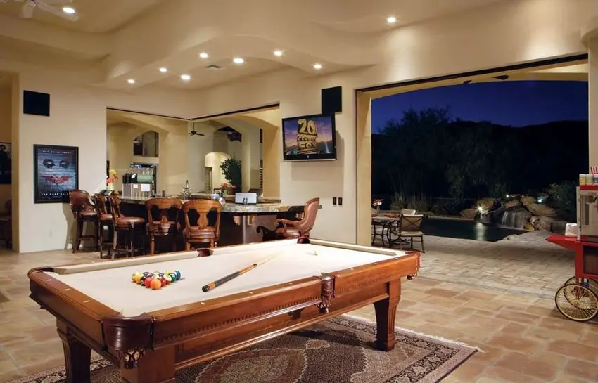 Open living area with views to backyard and swimming pool