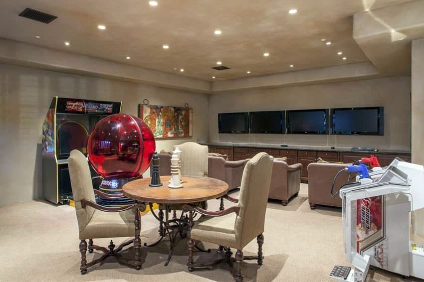Game dedicated space with wall mounted tvs and arcade games