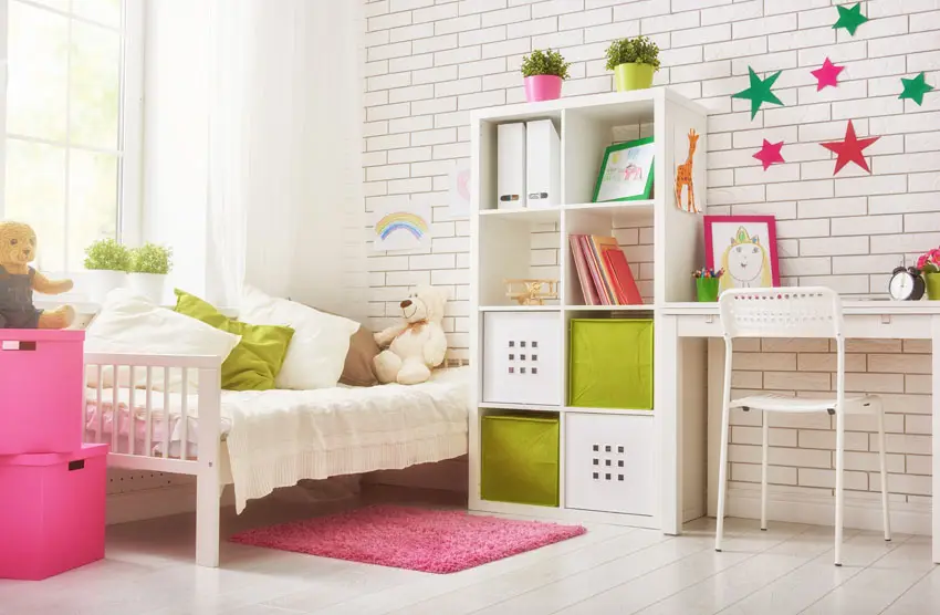 Girls arts and crafts bedroom with brick