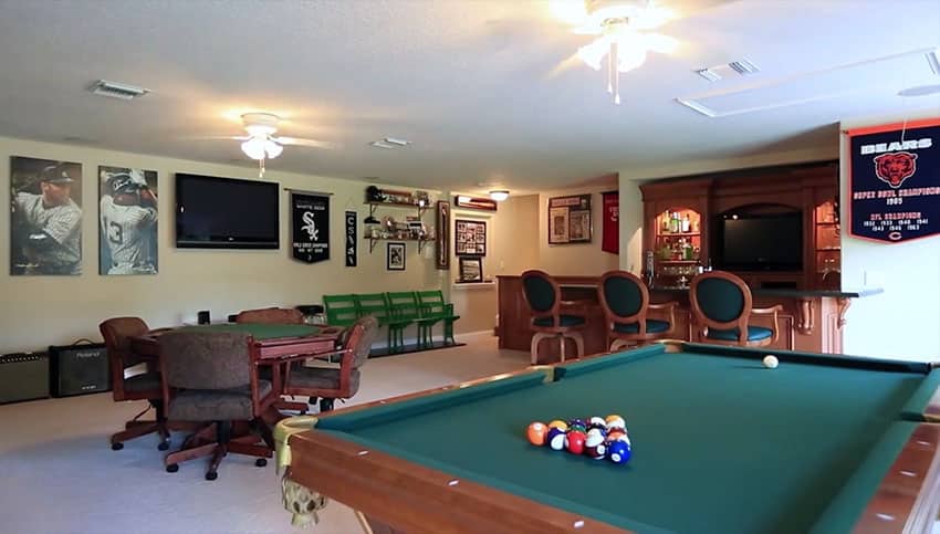 Home man cave with bar pool table and card table
