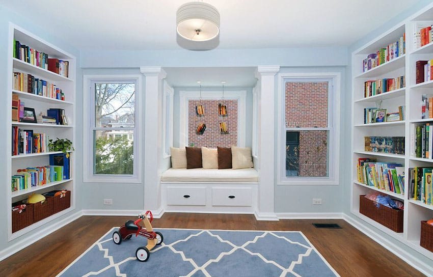 Kids playroom with alcove seats with two bookshelves