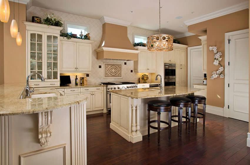 Kitchen with antique white cabinets and dark engineered mahogany floors