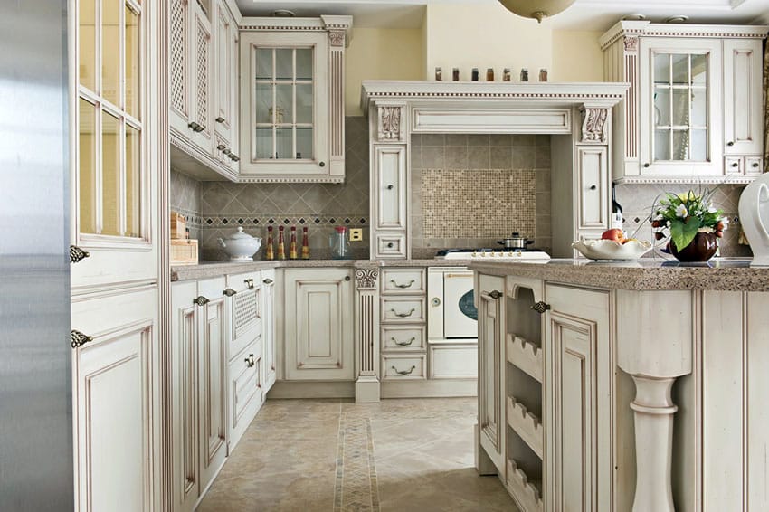French country kitchen with antique white cabinets and glass doors