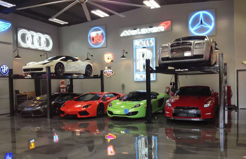 Luxury cars in modern garage with polished floors