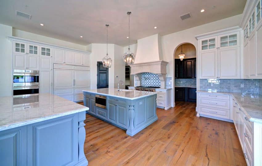 Expansive kitchen with window nook, counter and fabric breakfast chairs