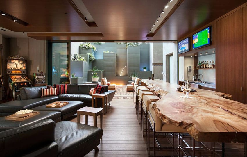 Luxury man cave lounge room with custom wood bar