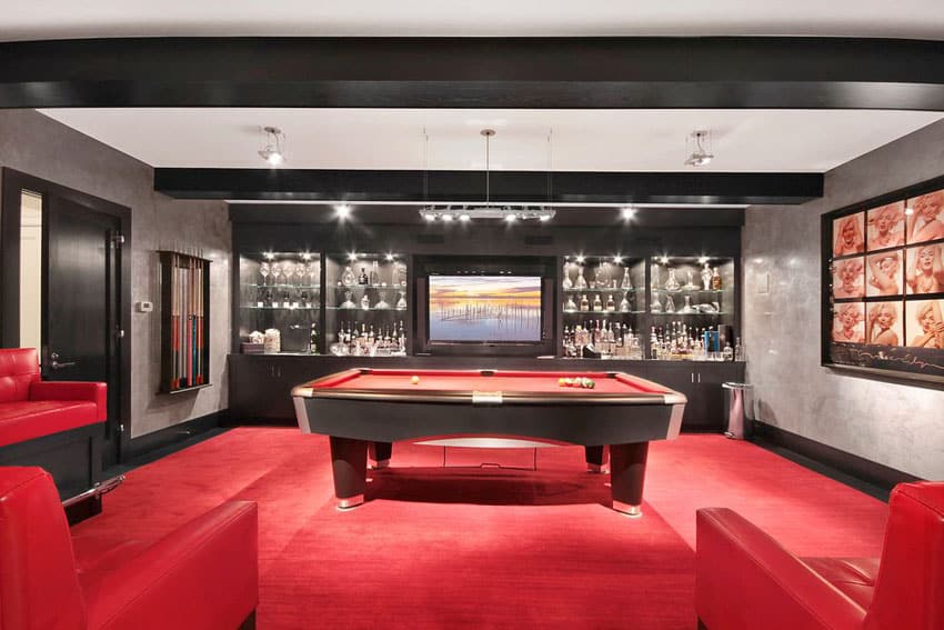 Luxury man cave with red and black decor and alcohol bar