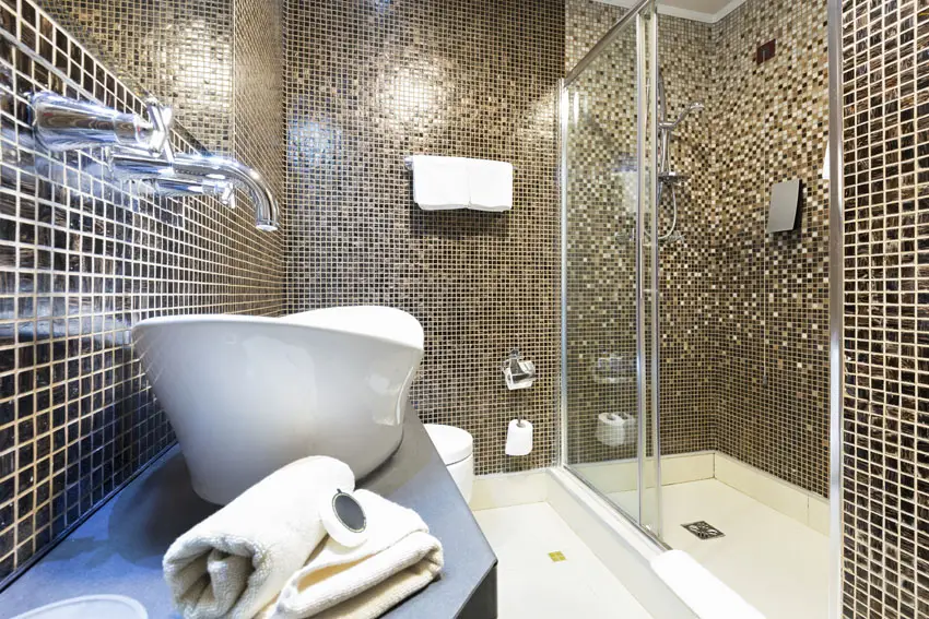 Modern bathroom with floor to ceiling gold mosaic tile