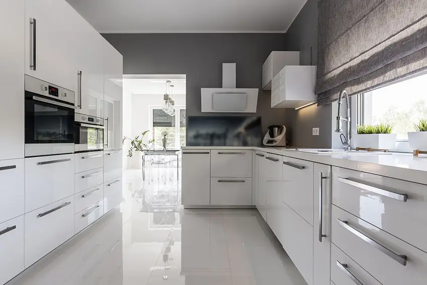 Kitchen with cabinetry in white finish and gray painted walls