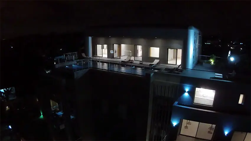 Modern custom designed apartment with rooftop swimming pool at night