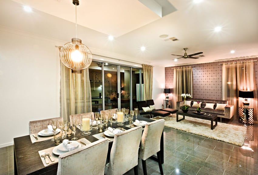 Room with ceramic flooring, table made of dark oak and sliding door