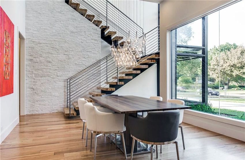 Room with hardwood floors and 16 light mini pendant lamp