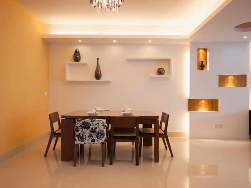 Modern dining room with lighted wall alcoves