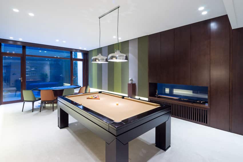 Modern game room man cave with poker table and pool table