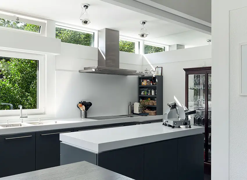 Modern gray and white kitchen with skylights