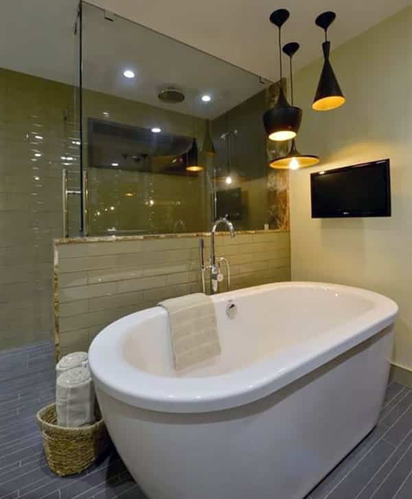 Modern master bathroom with slate tile floor freestanding tub and black pendant lights