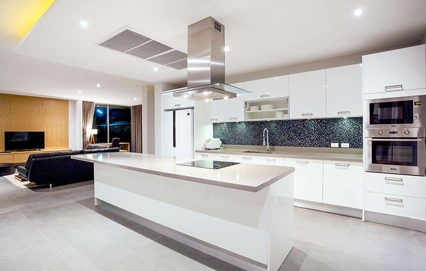 Modern single wall kitchen with island white cabinets and open plan layout