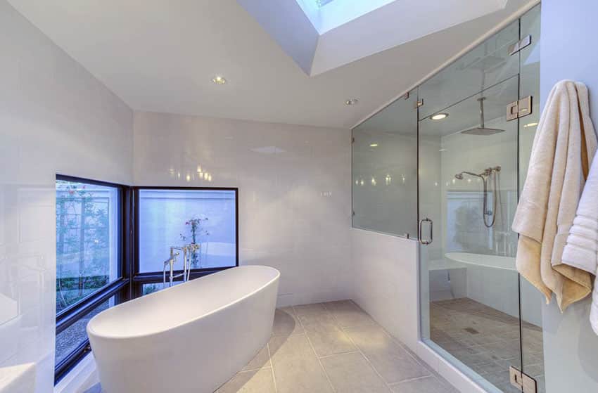 Modern white bathroom with large shower with rainfall showerhead