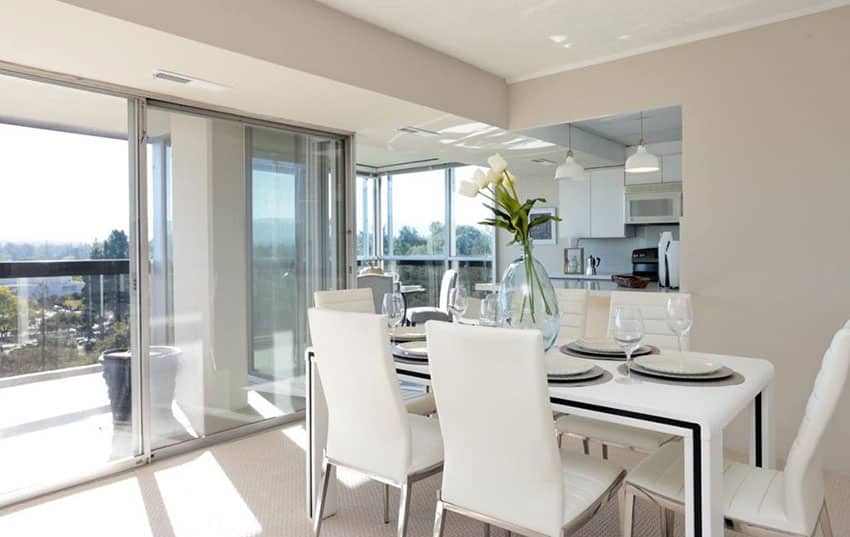 Room in beautiful home with balcony view and white dining set