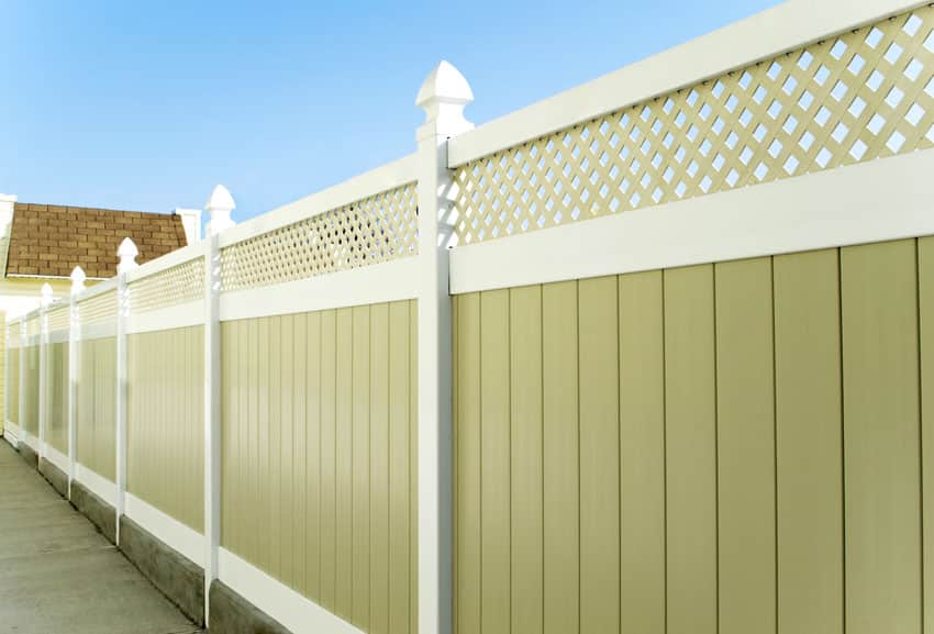 Composite flat board fence in a yard