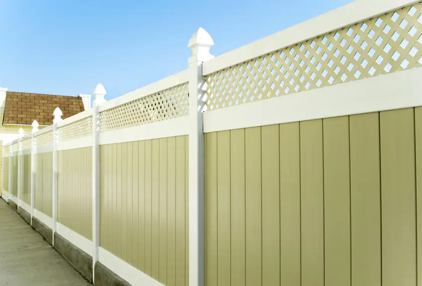 Composite flat board fence in a yard