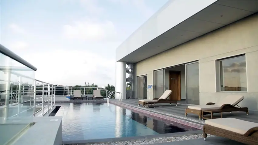 Rooftop apartment swimming pool with lounge chairs