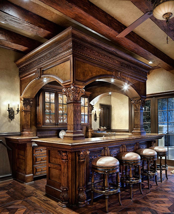 Rustic wood home wet bar with glass door cabinetry