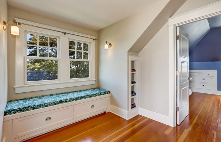 Built-in bench placed by a double casement window