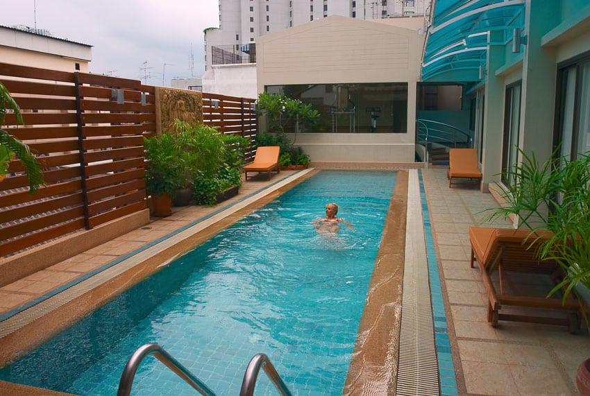 Horizontal wood slat privacy around swimming pool
