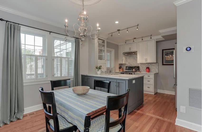 Small kitchen with peninsula and white main cabinets