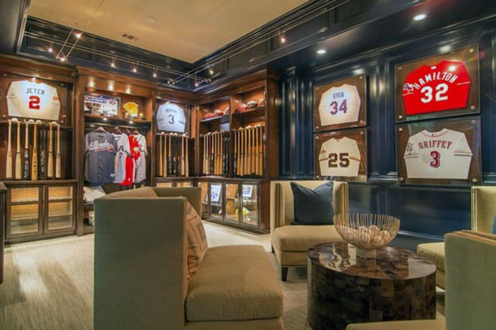 Sports-themed room memorabilia in display cases