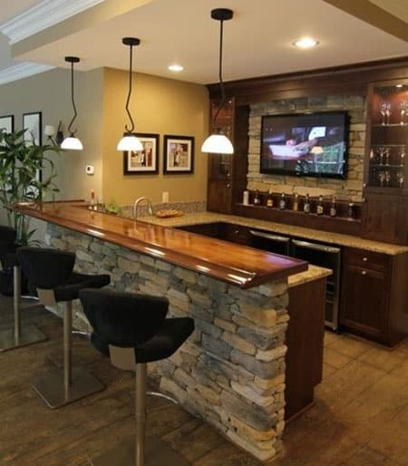 Stacked stone home wet bar with u shaped layout