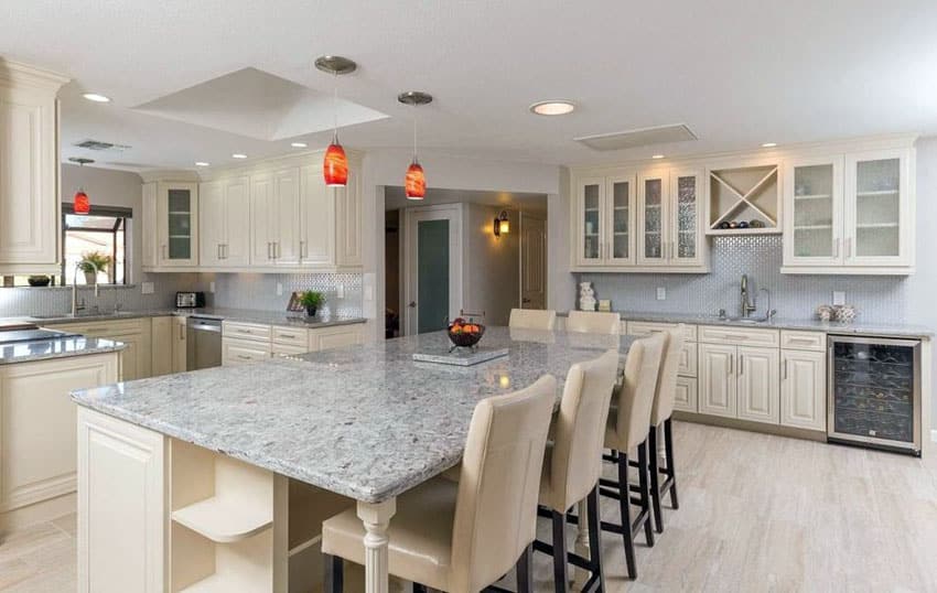 Traditional kitchen with andino white countertops, and breakfast bar island