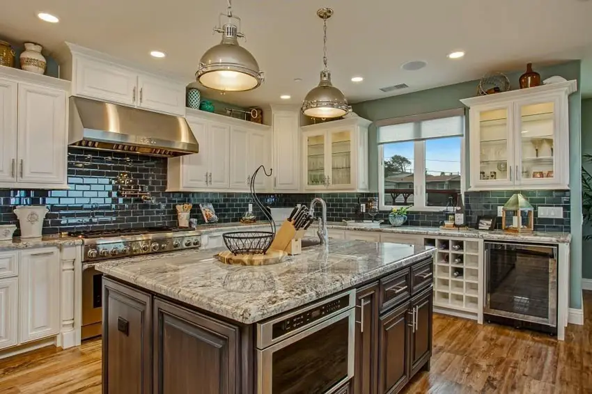 Transitional kitchen with antique white cabinets and vases, pottery and decor