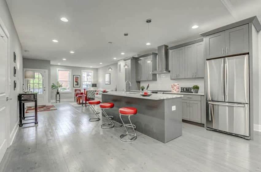 Gray Kitchen Cabinet Island transitional kitchen with gray cabinets and white marble countertops with breakfast bar island