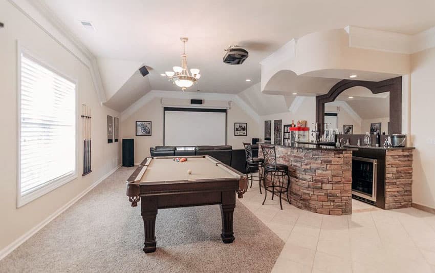 Upstairs game room and home bar with stacked stone