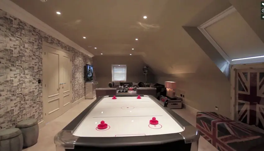 Attic loft with air hockey and furniture