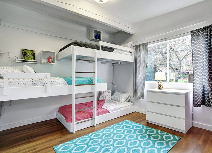 Girls bedroom with white triple bunk-style beds