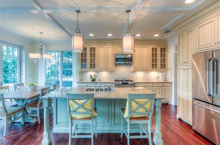 White kitchen with light blue island breakfast bar and box ceiling