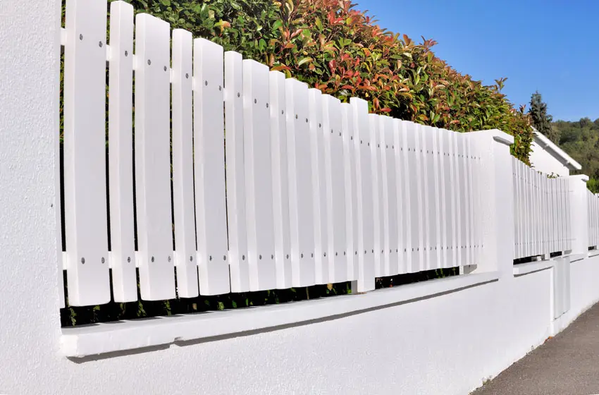 White pvc fence in yard
