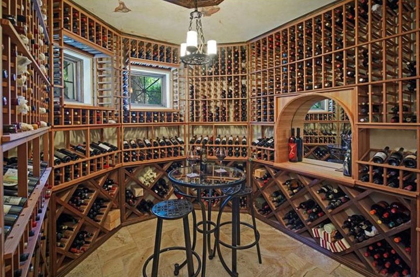 Large custom wood wine cellar with floor to ceiling bottle storage