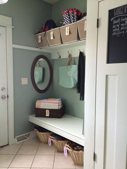 Contemporary mud room with bench wicker laundry basket storage and coat hangers