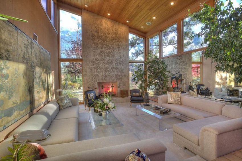 Contemporary sunken living room with high ceilings and fireplace