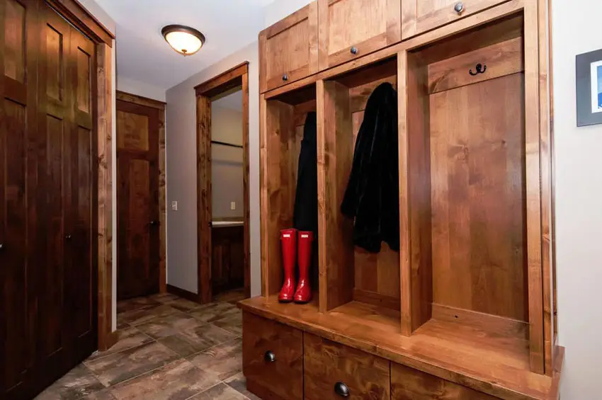 Mudroom with heavy grained wood finish and stone flooring