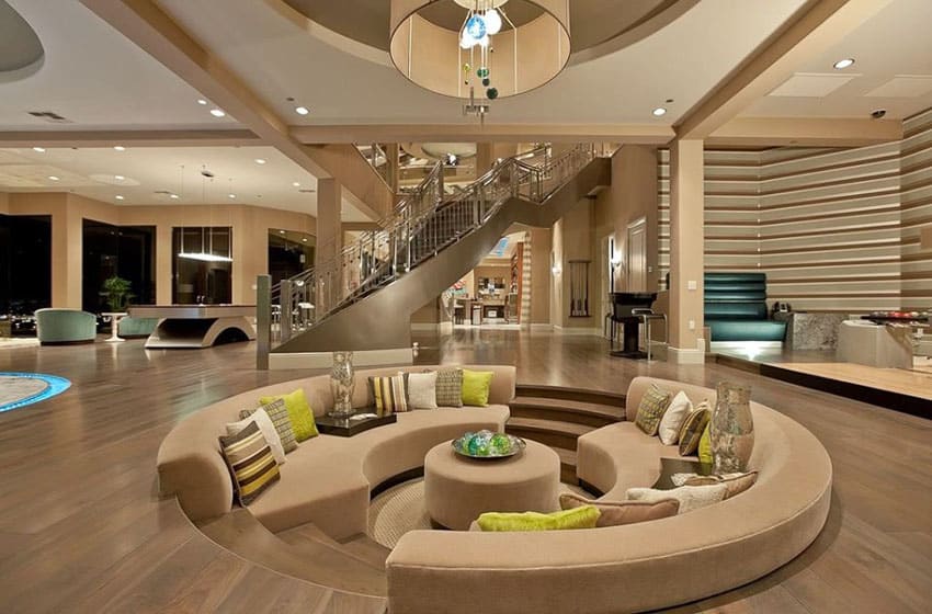 Luxury sunken living room with wood flooring and high ceilings